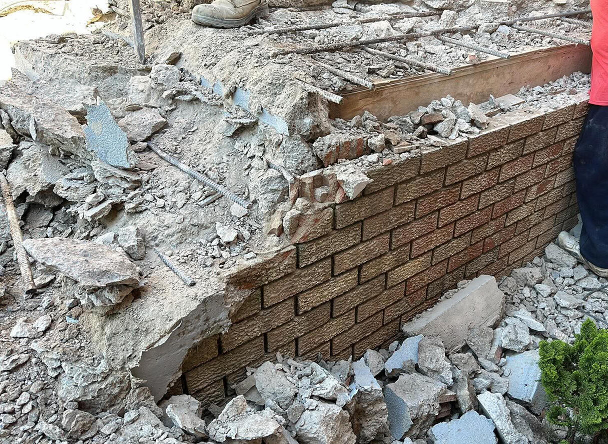 Full front porch rebuild with brick and concrete blockwork by McNamara Masonry in Amherstburg, Ontario, Canada. Expert masonry services including porch restoration, brick repair, and stonework installation.