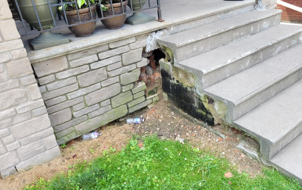 Expert masonry services including porch restoration, brick repair, and stonework installation.